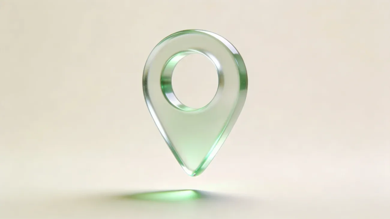Stylized glass location pin floating above a clean surface, gentle green accent glow
